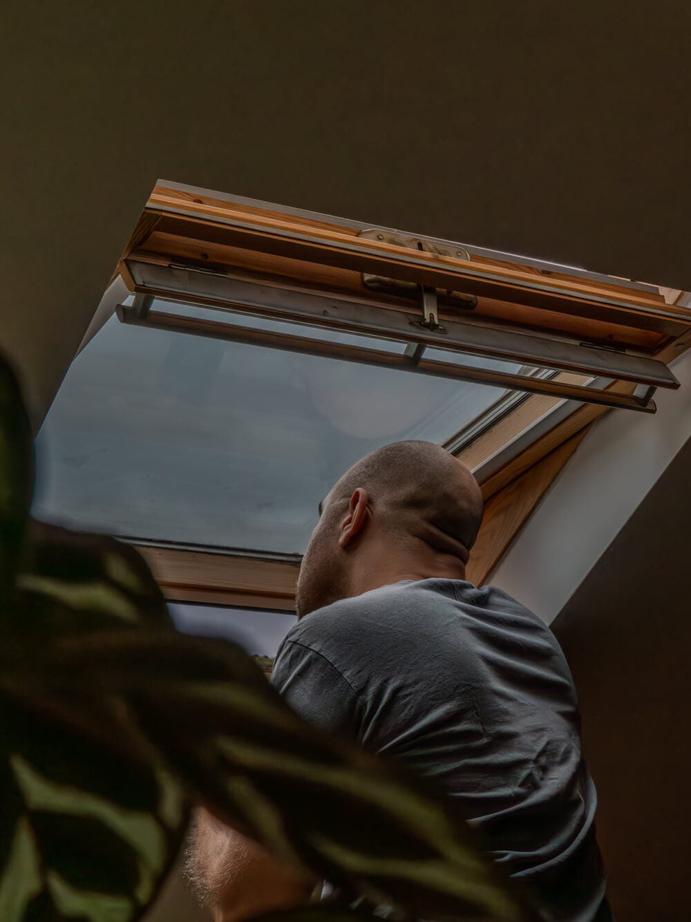 Ruben Madila - Self-portrait, looking outside the ceiling window on my East London attic. 